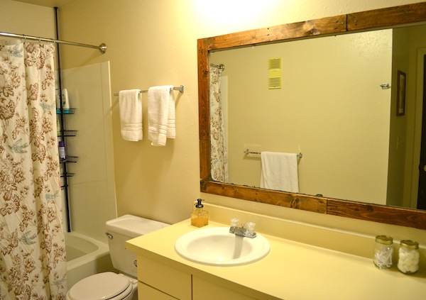 Framing A Bathroom Mirror with Pallets from Rachel Schultz