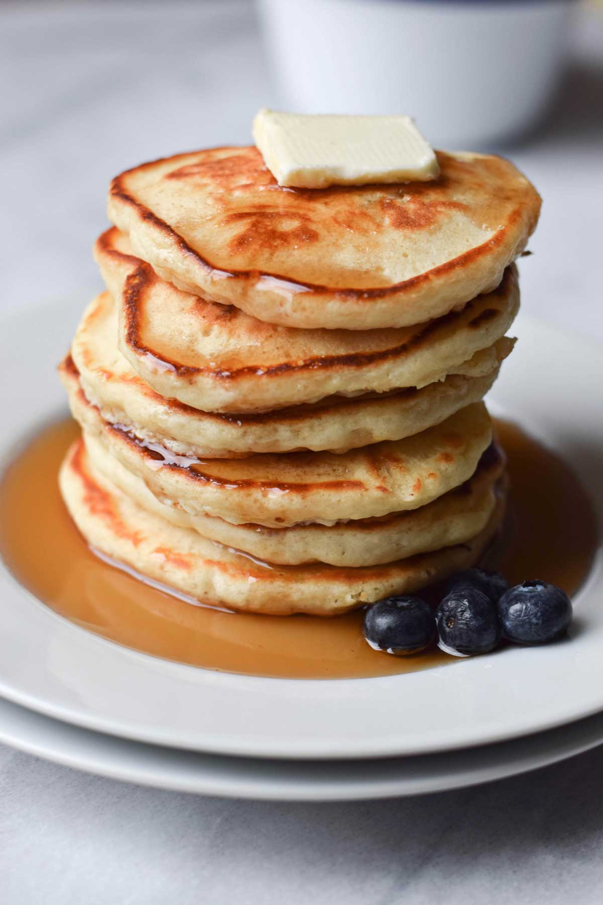 Old Fashioned Pancakes with Syrup, Butter, and Blueberries